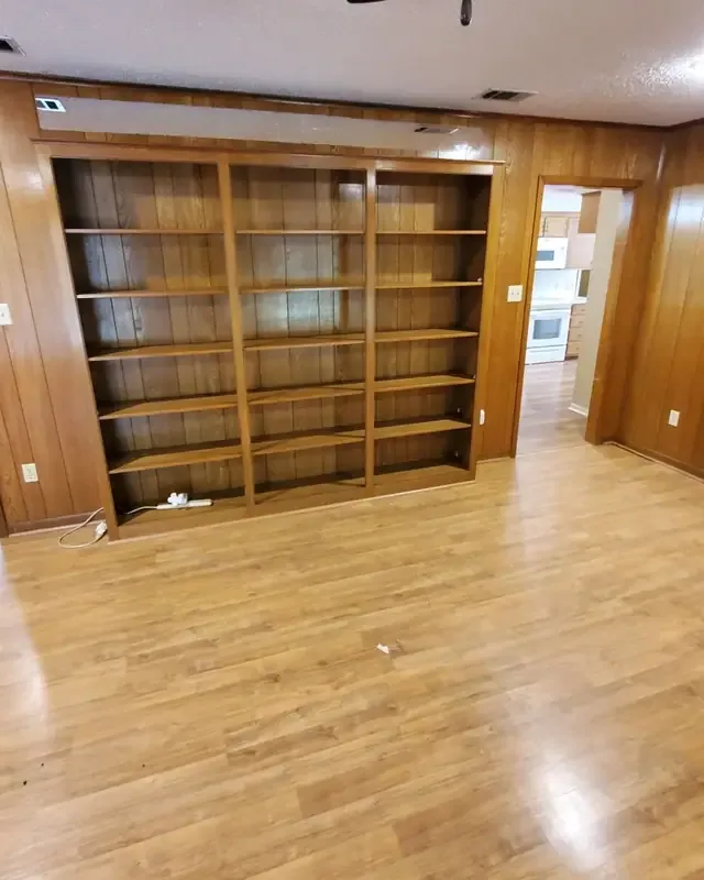 Built-in wooden shelves after the belongings were removed